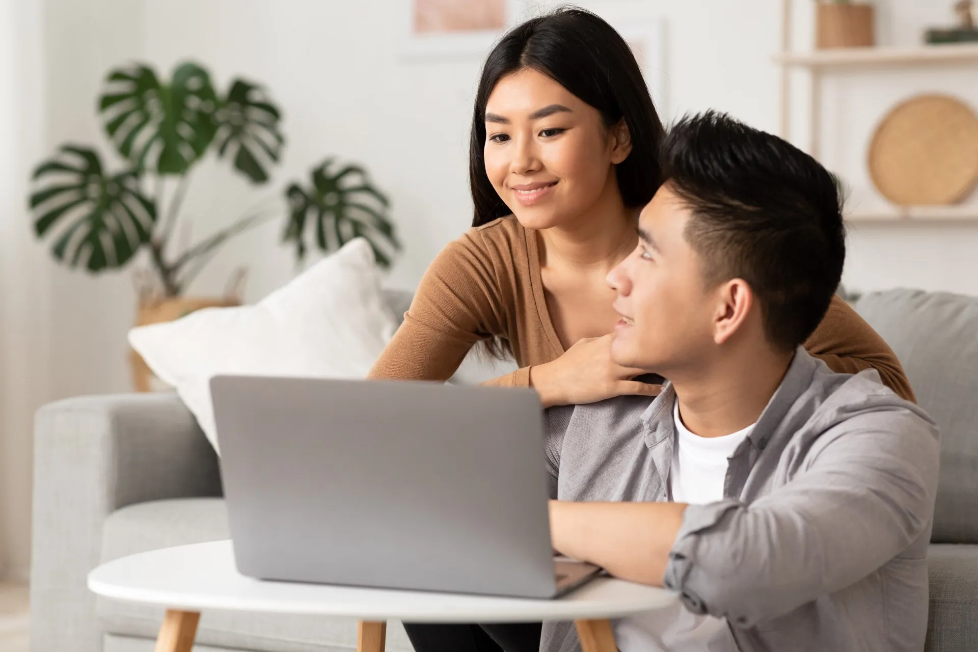 Young Filipino Couple Using Laptop At Home Farjj9g 1920w